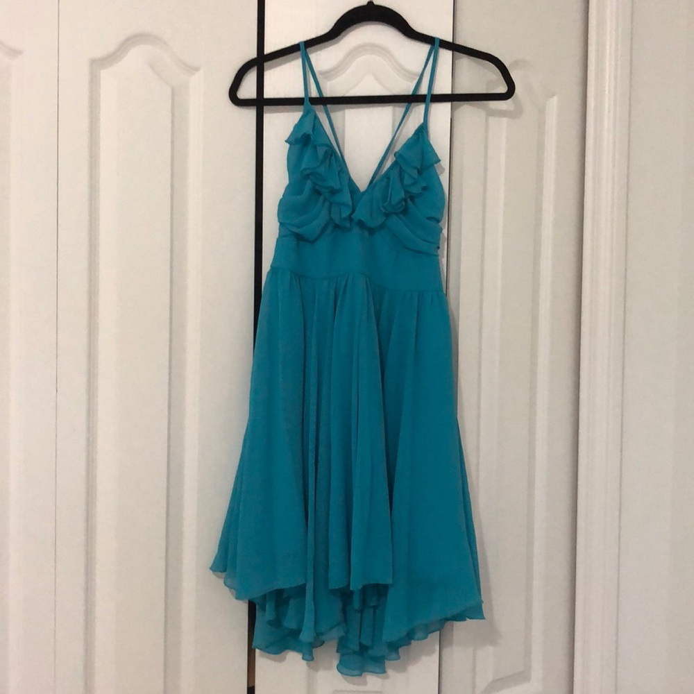 Turquoise halter dress with criss-cross backing